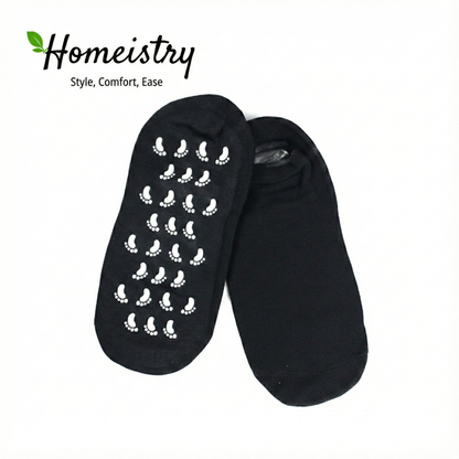 Black spa gel socks showing white non-slip grips, isolated on white background.