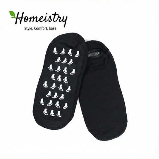 Black spa gel socks showing white non-slip grips, isolated on white background.
