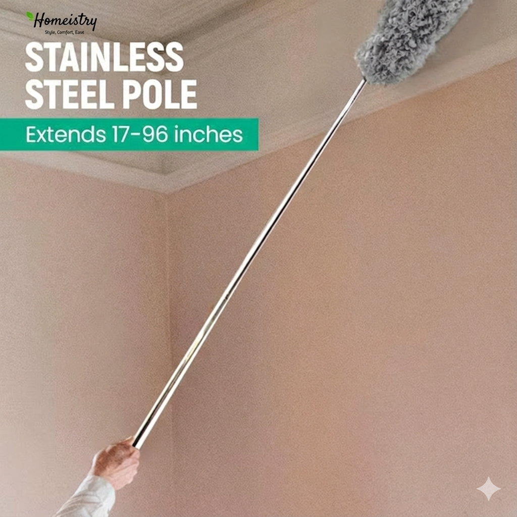 Stainless steel pole with a fluffy brush attachment, extending from a hand to the ceiling, against a beige wall.