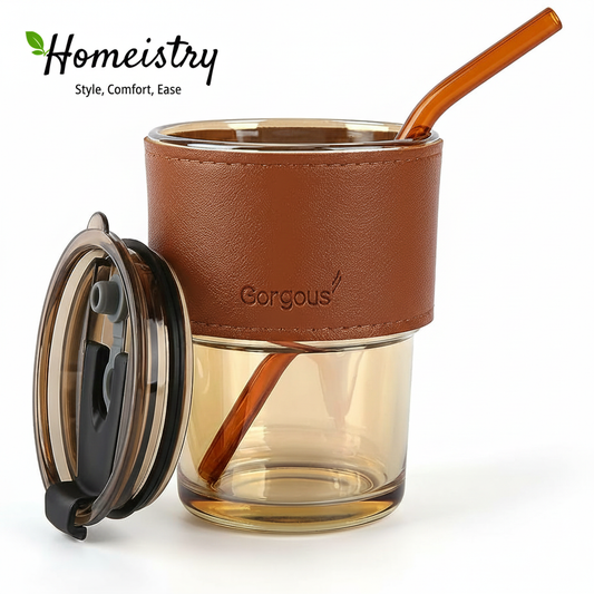 Glass tumbler with brown leather sleeve and straw, featuring the 'Gorgous' brand, on a white background.