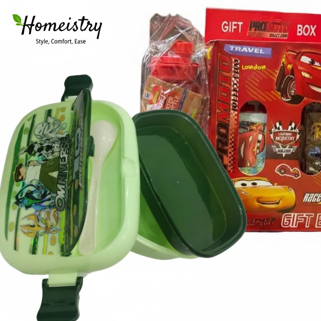 Green children's lunchbox with cartoon design, red gift box with toys in the background, Homeistry brand visible.