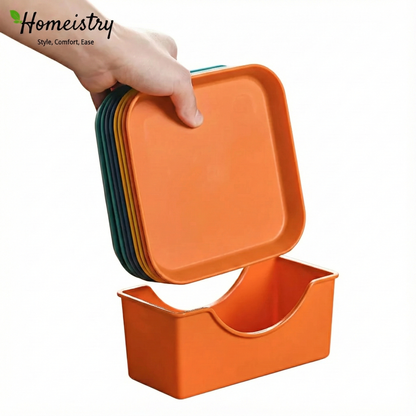 Orange container with a lid held by a hand, with 'Homeistry' branding.