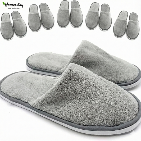 Gray slippers with Homeistry branding on a white background