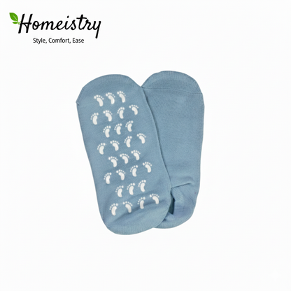 Pair of light blue moisturizing gel socks flat lay with non-slip soles visible.