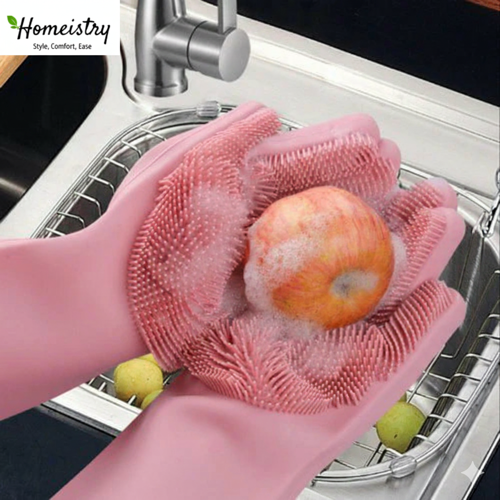 Pink silicone gloves washing an apple in a kitchen sink with 'Homeistry' branding.