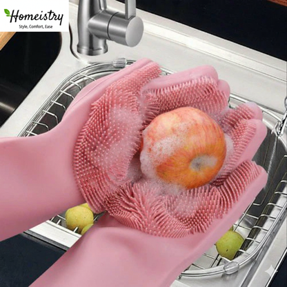 Pink silicone gloves washing an apple in a kitchen sink with 'Homeistry' branding.