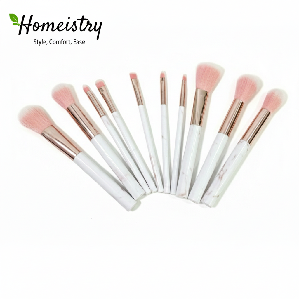 Set of makeup brushes with pink bristles on a white background, branded 'Homeistry'.