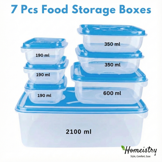 Set of seven food storage boxes with blue lids and labels, displayed on a white background.