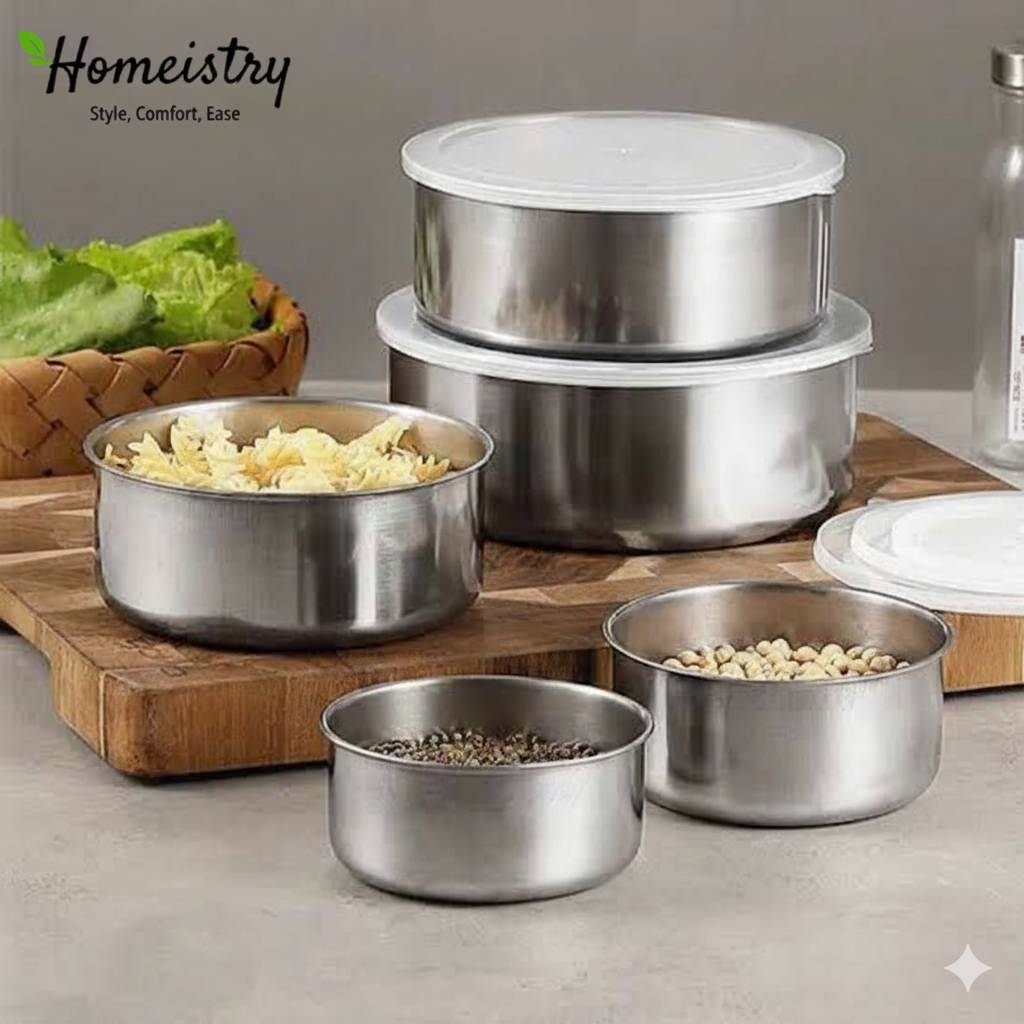Set of stainless steel food containers with lids on a kitchen counter, featuring the Homeistry brand.