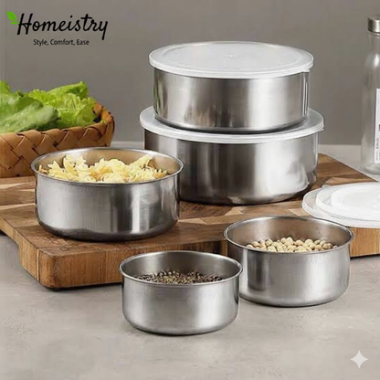 Set of stainless steel food containers with lids on a kitchen counter, featuring the Homeistry brand.