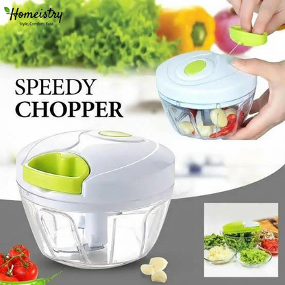 Speedy Chopper with vegetables and a hand using it, branded 'Homeistry'.