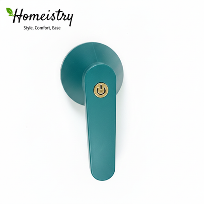 Teal lint remover back side with gold lock on a white background, featuring the Homeistry brand.