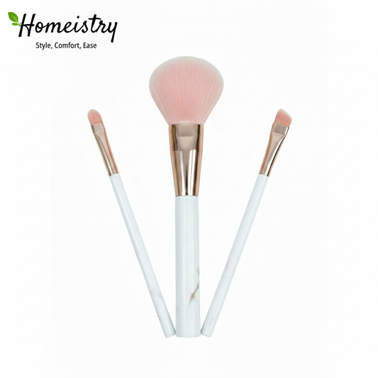 Three makeup brushes with pink bristle heads on white background, branded 'Homeistry'.