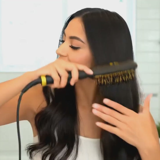 Girl Straightening Hair with 909 Hair Straightner Brush