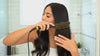 Girl Straightening Hair with 909 Hair Straightner Brush
